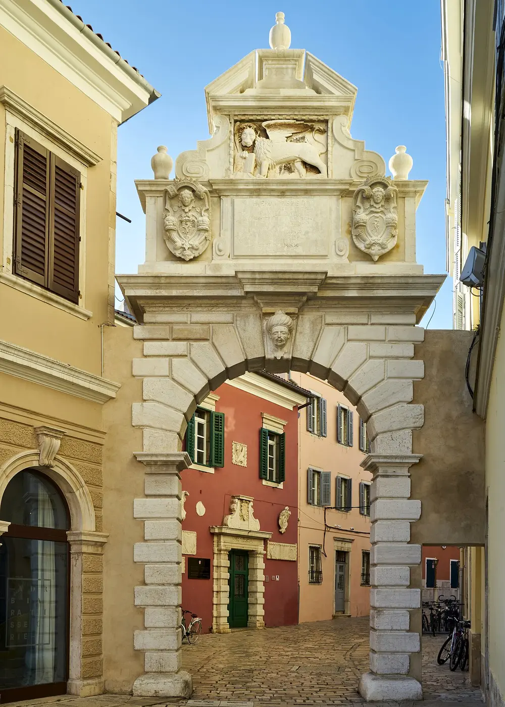 The Balbi Arch, a stone town gate in Rovinj topped with a Venetian lion relief