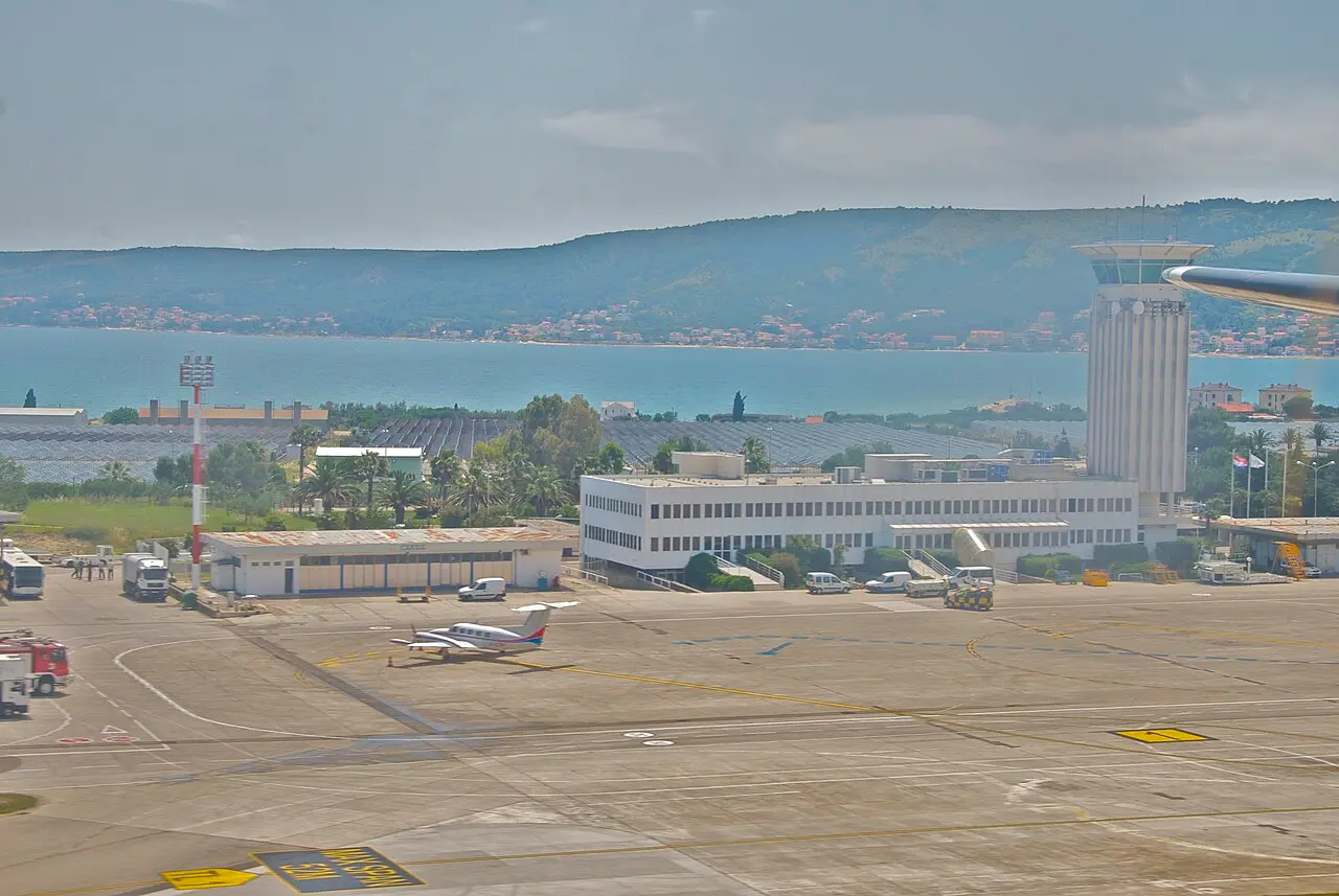 Aerial view of Split Airport apron and runway by the Adriatic sea and Kaštela bay