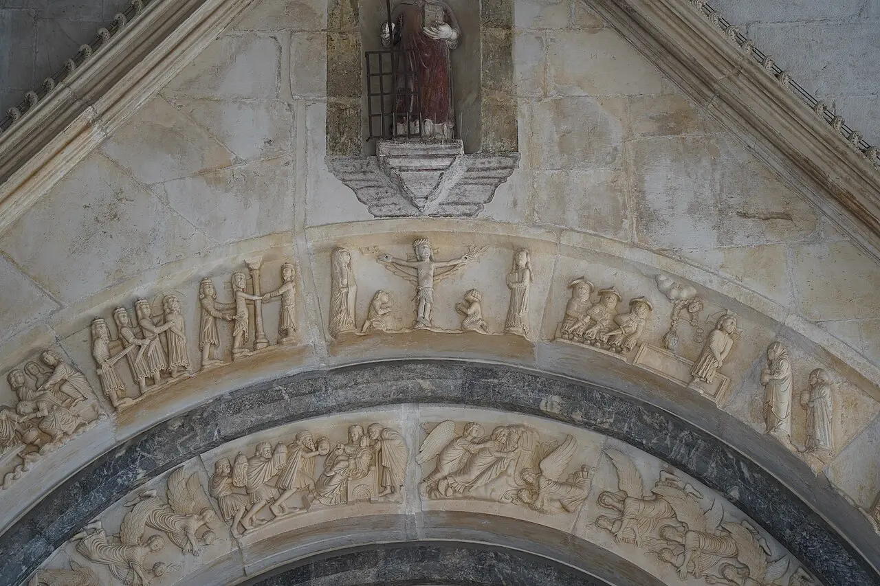 Detail of the carved stone Radovan portal on the cathedral of St Lawrence in Trogir, showing the Nativity and medieval reliefs