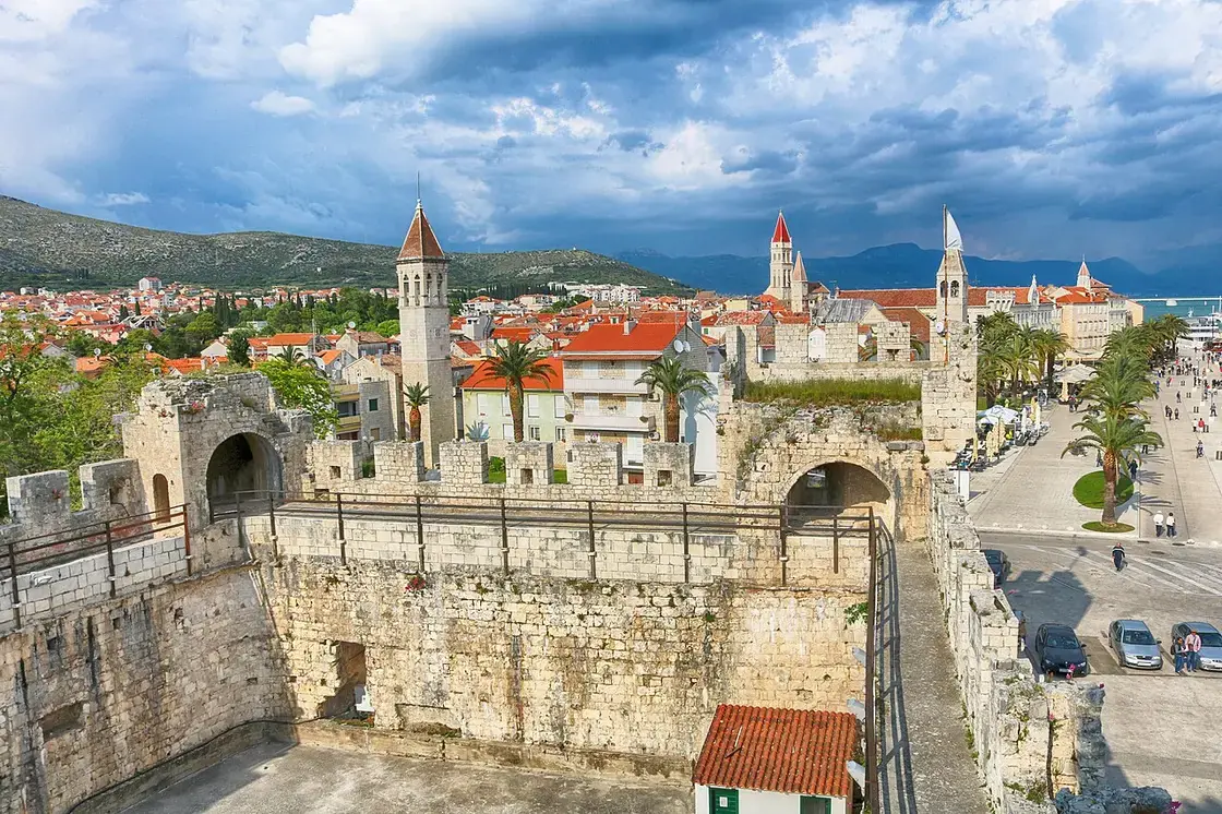 View over the terracotta rooftops and bell towers of Trogir old town from the ramparts of Kamerlengo fortress