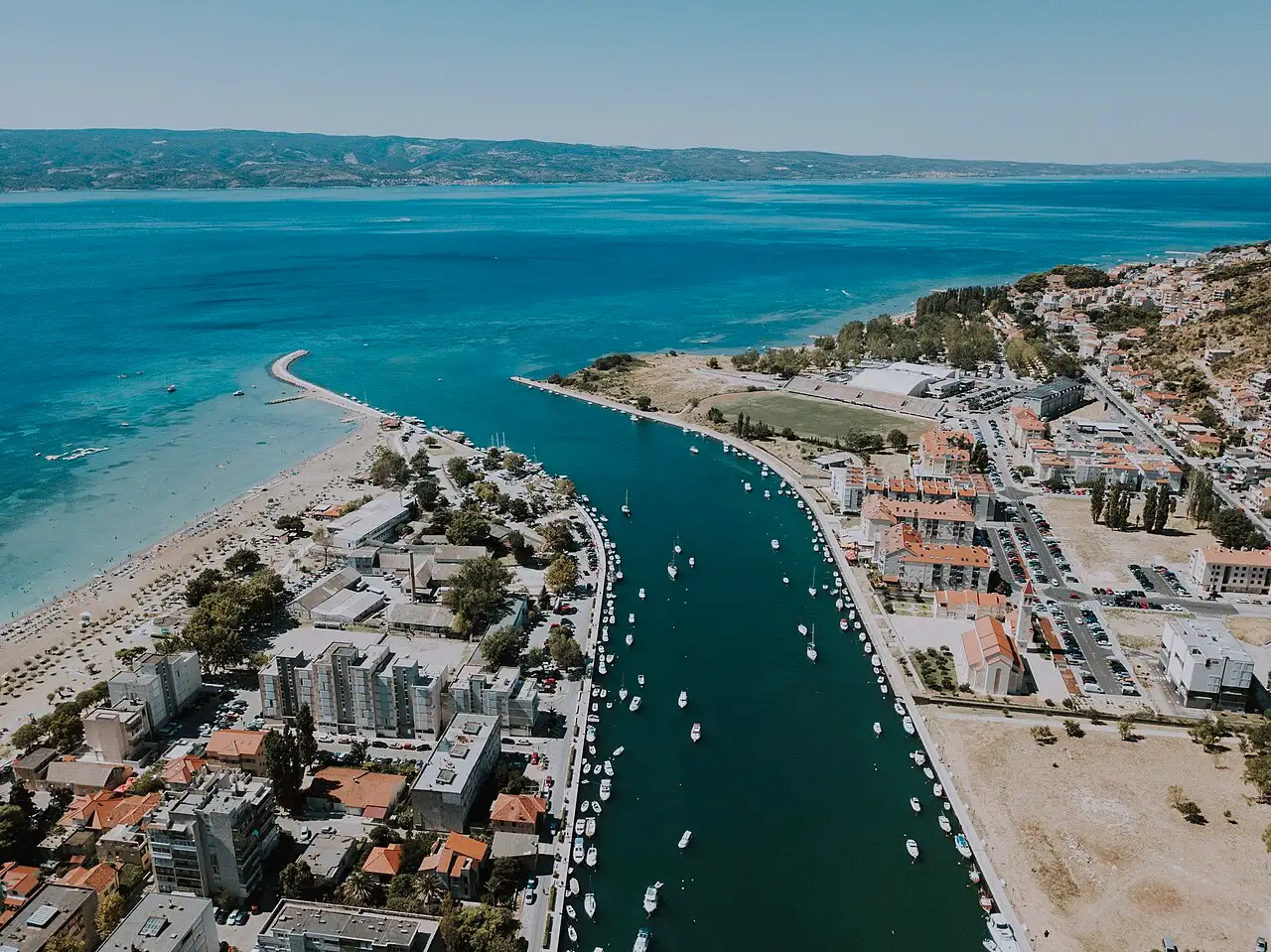 The Cetina river meeting the Adriatic at Omiš, where the official Ultra camping combo is based