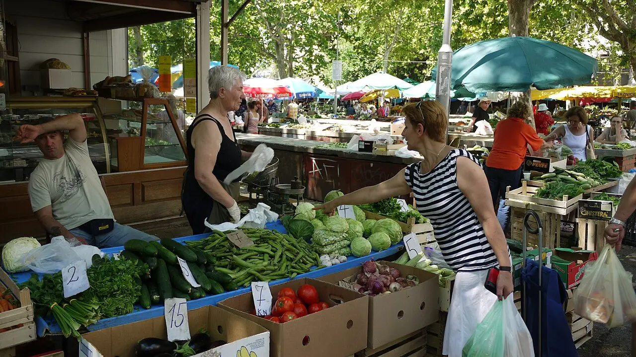 Vegetable stalls under plane trees at the Pazar green market in Split
