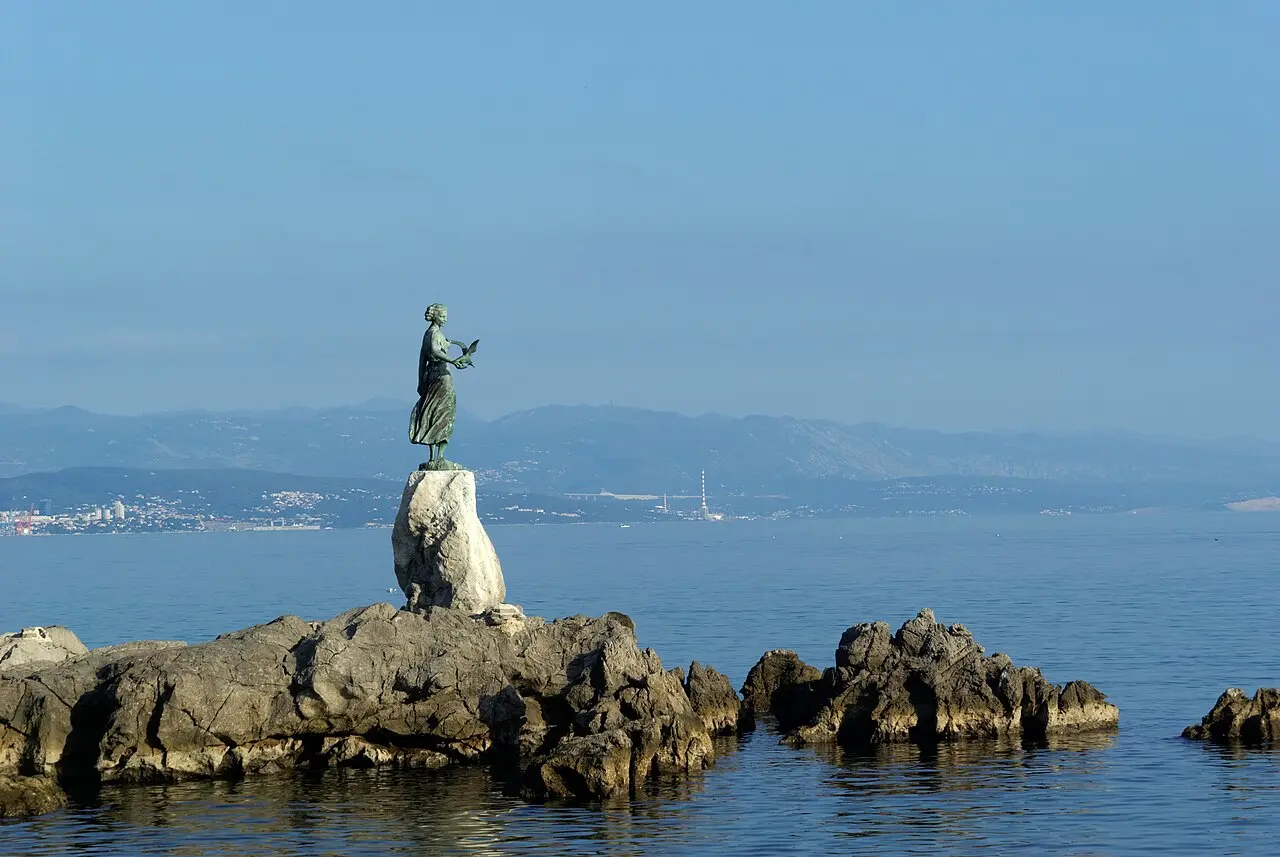 The Opatija waterfront and hotels along the Kvarner Gulf under a clear sky