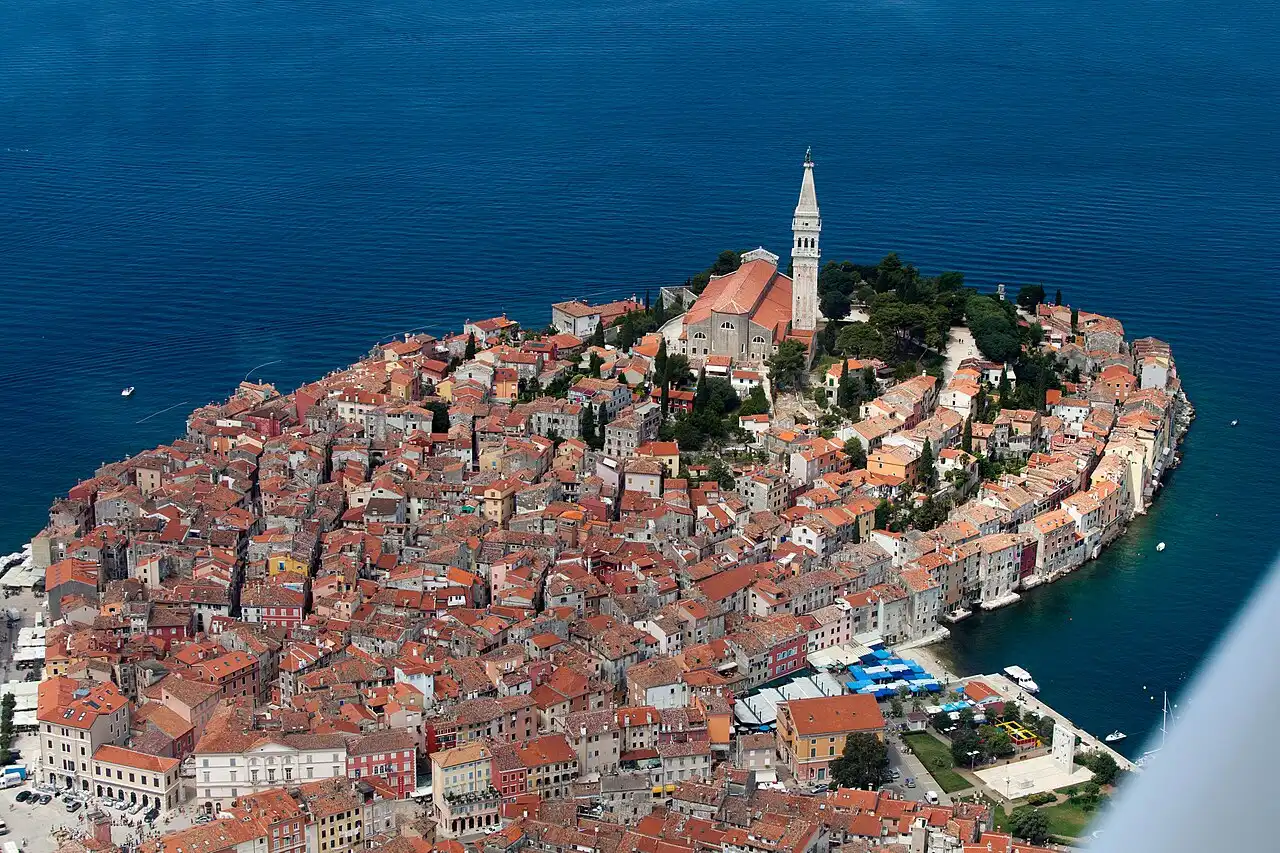 The old town of Rovinj rising from the Adriatic with the church of St Euphemia on the hill