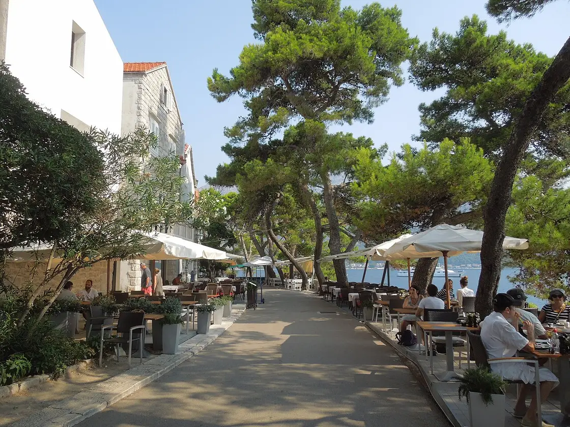 The stone seafront promenade of Korčula Town with cafes and the old town walls