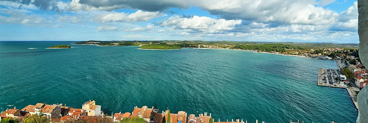 Panoramic view from the St Euphemia bell tower over the Rovinj harbour, marina and coastline stretching into the distance