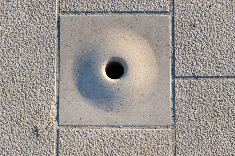 Close-up of one of the sound holes and steps of the Zadar Sea Organ with the sea beyond