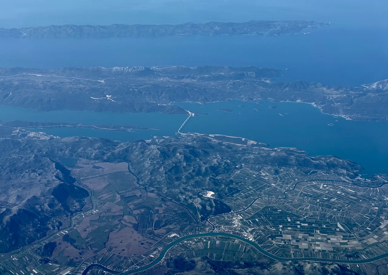 Aerial view of the cable-stayed Pelješac Bridge spanning the sea channel in southern Dalmatia