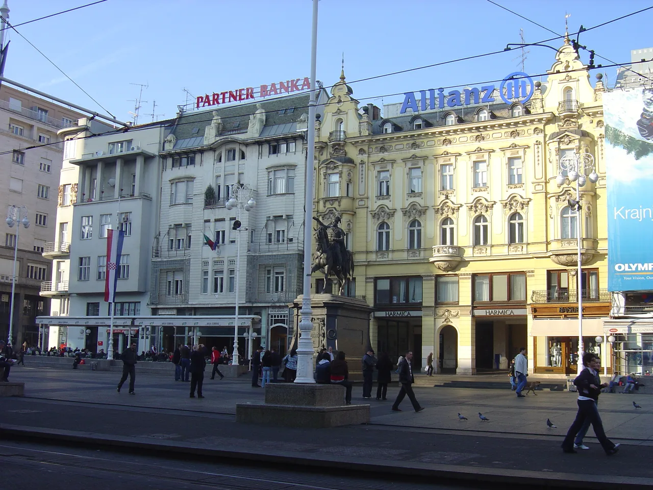 Trams and pedestrians crossing Ban Jelačić Square in central Zagreb
